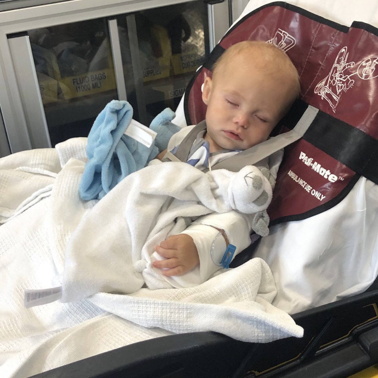 Luca resting in an ambulance, being transported for an emergency blood transfusion